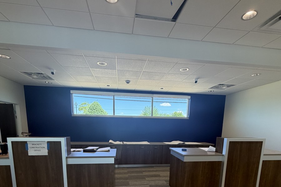 Bank teller line installation overview dark walnut cabinets by Robertson Cabinets Ohio