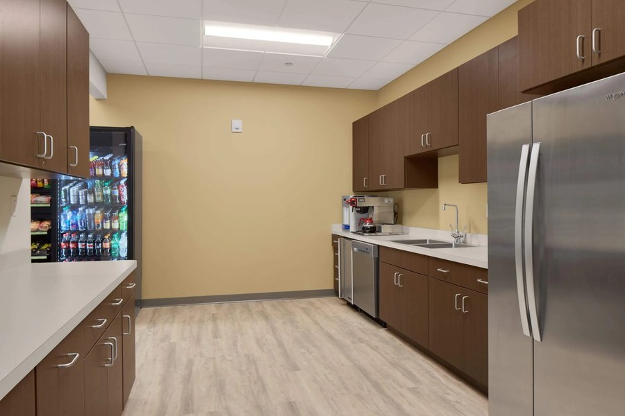 Corporate break room kitchen casework dark walnut cabinets by Robertson Cabinets Ohio