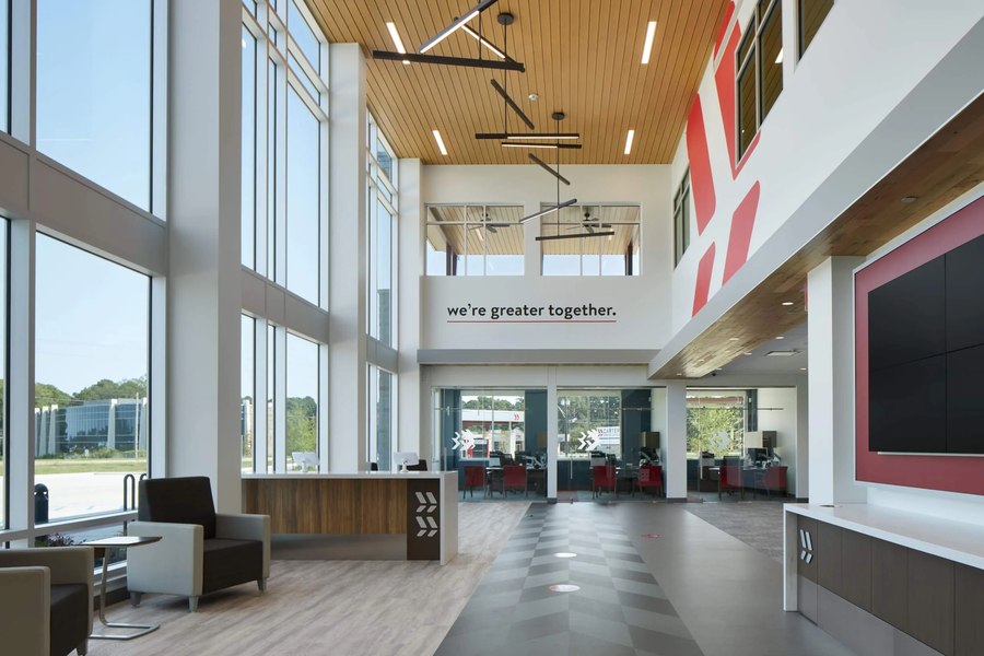 Two-story credit union atrium lobby — Robertson Cabinets