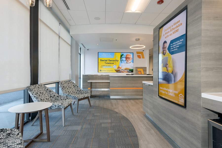 Credit union lobby with lounge seating area and teller line casework by Robertson Cabinets