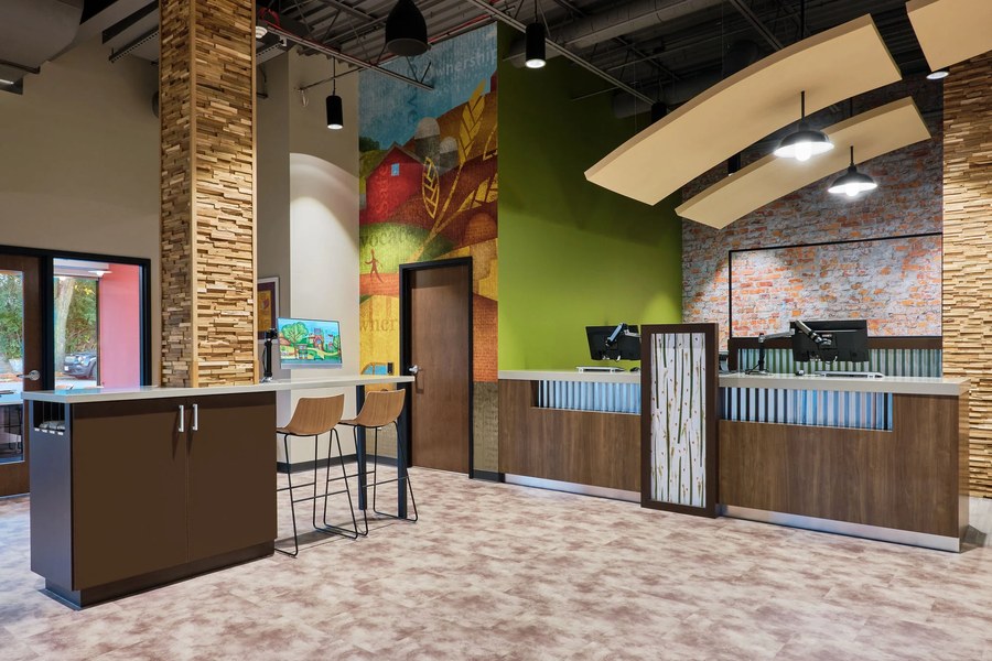 Credit union branch greeter station and entrance millwork by Robertson Cabinets