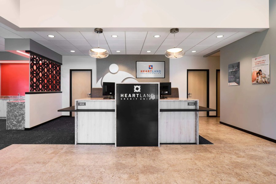 Credit union teller area with custom reception casework and branded signage by Robertson Cabinets