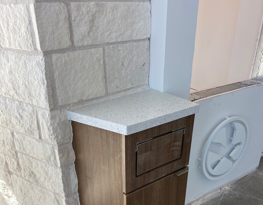 Custom casework unit with stone top under construction by Robertson Cabinets